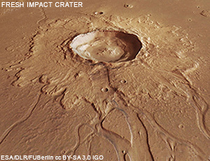  View of an impact crater surounded by material ejected by the impact